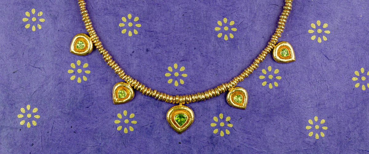 Peridot Jewellery on a Purple Background