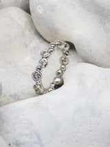 Full Diamond Eternity Ring on Stone Background