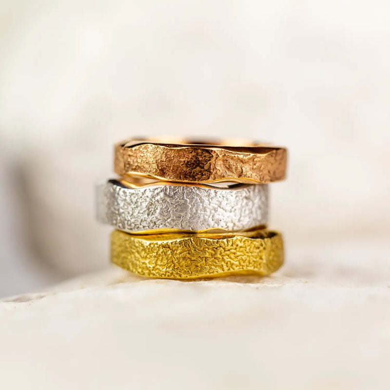 Three wedding rings on top of each other
