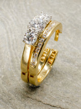 Hinged engagement and wedding ring on a stone background