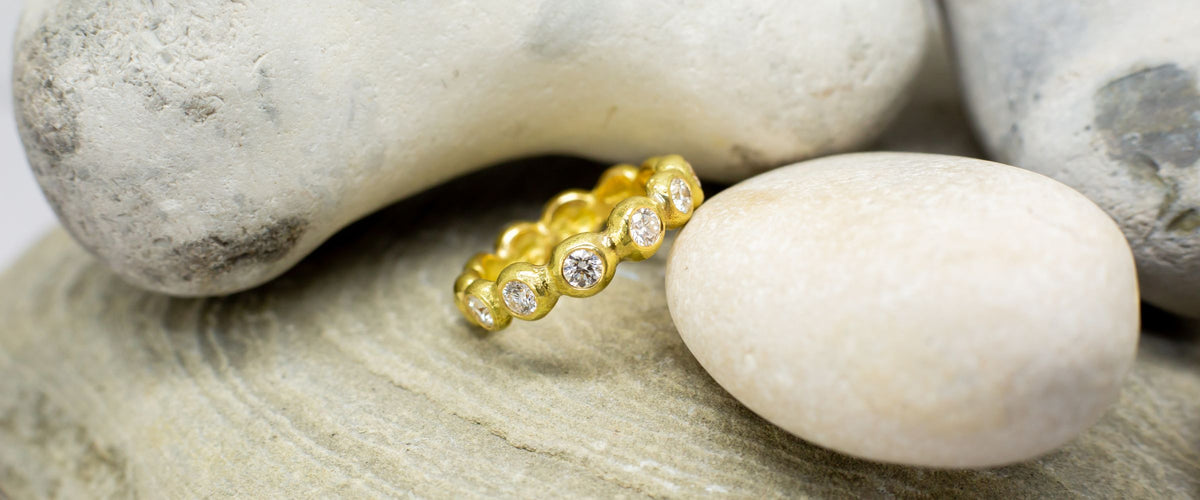 Gold nugget ring with full diamond eternity ring