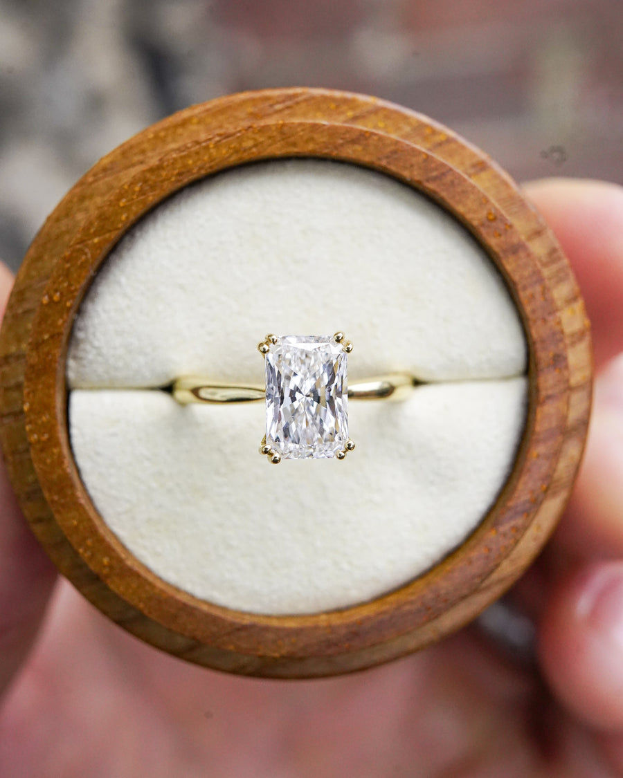 Radiant cut lab-grown diamond engagement ring with a hidden halo set in 18ct yellow gold.