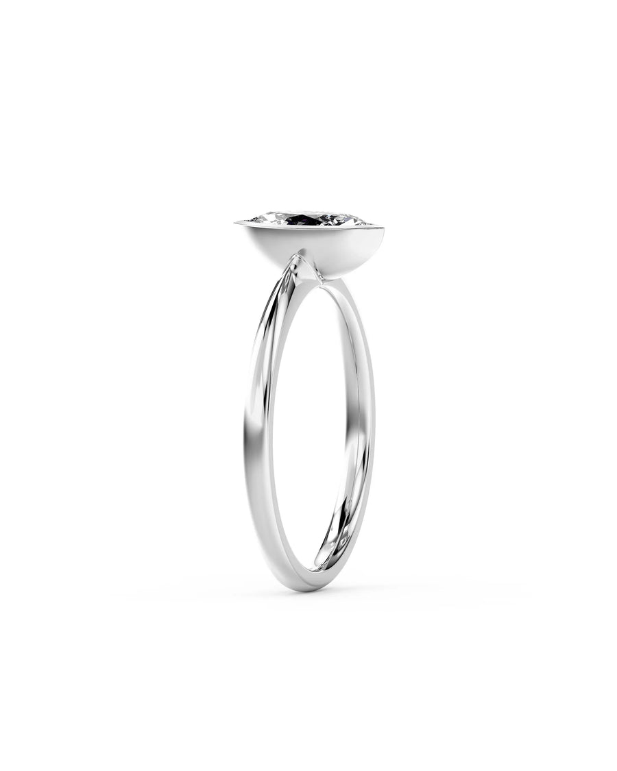 Platinum marquise cut natural diamond bezel engagement ring.