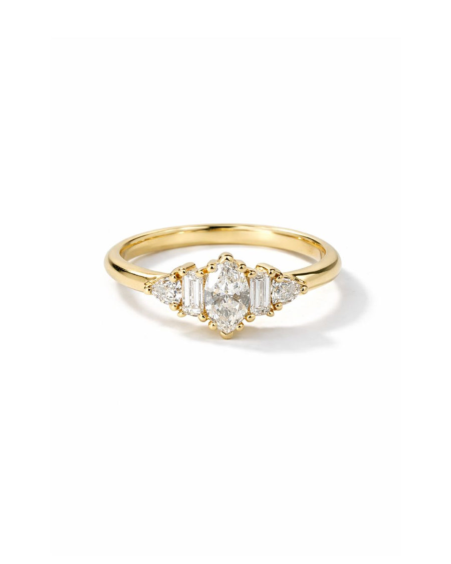 Gold engagement ring with a marquise cut diamond and claw side stones.