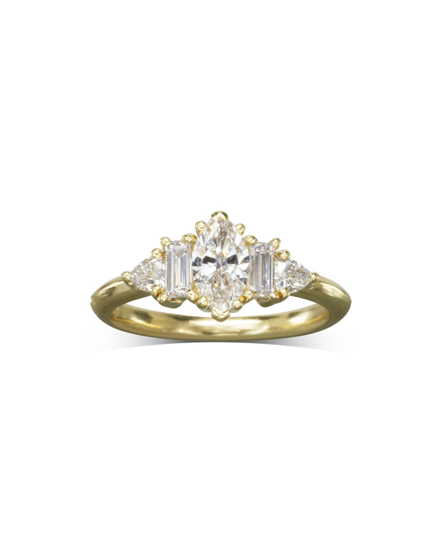 Yellow gold engagement ring with a marquise cut center diamond and claw side stones.