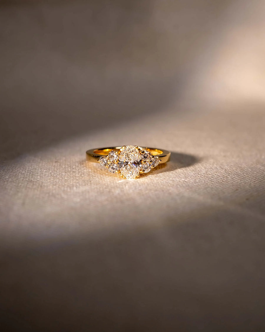 Handcrafted gold diamond ring with organic shapes on textured fabric, luxury jewellery design