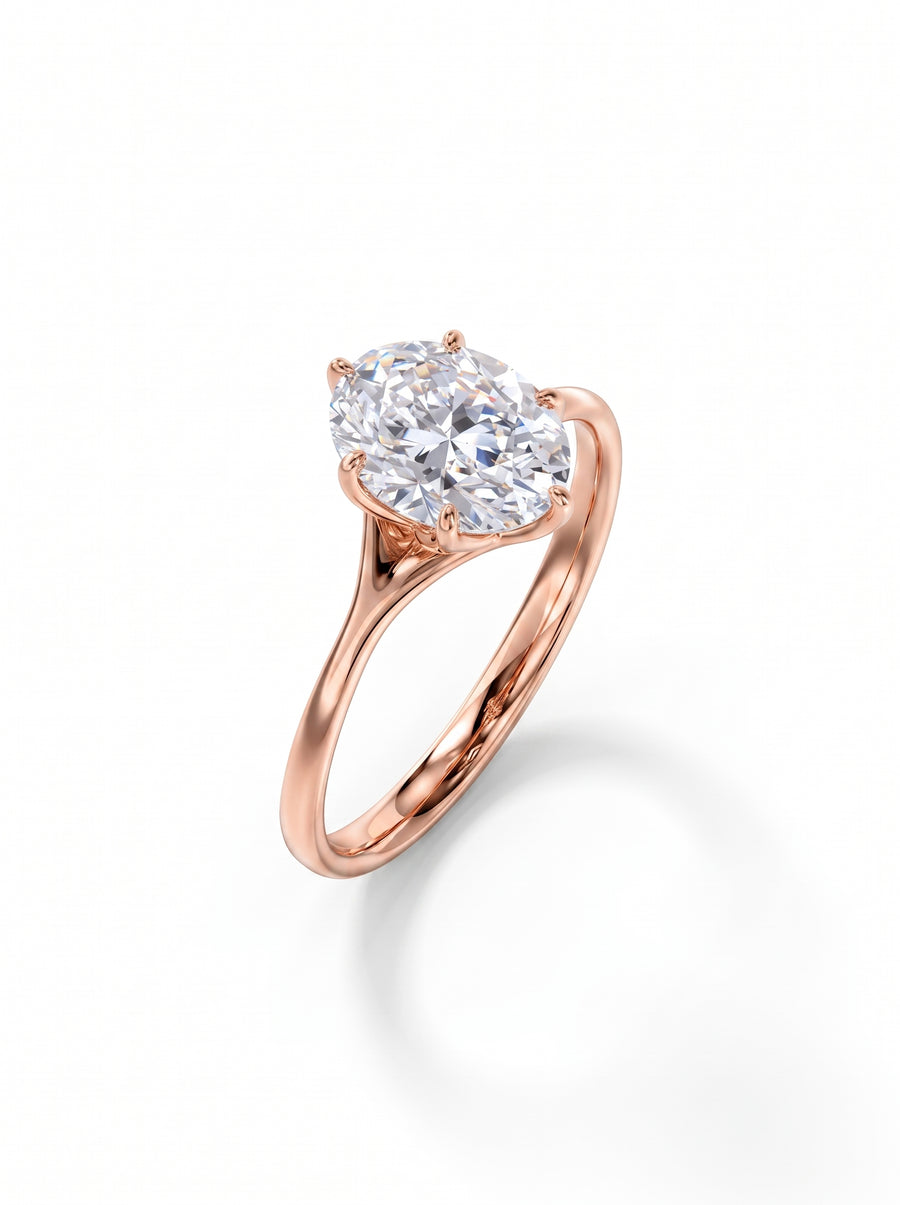 Oval cut diamond engagement ring in a rose gold tulip claw setting on a white background.