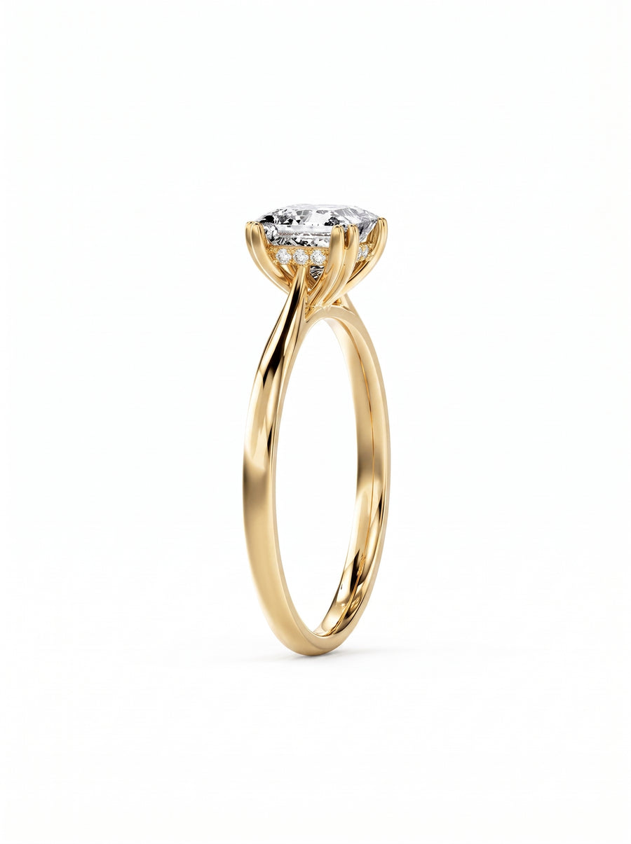 Princess cut diamond engagement ring with a hidden halo set in polished 14k yellow gold.