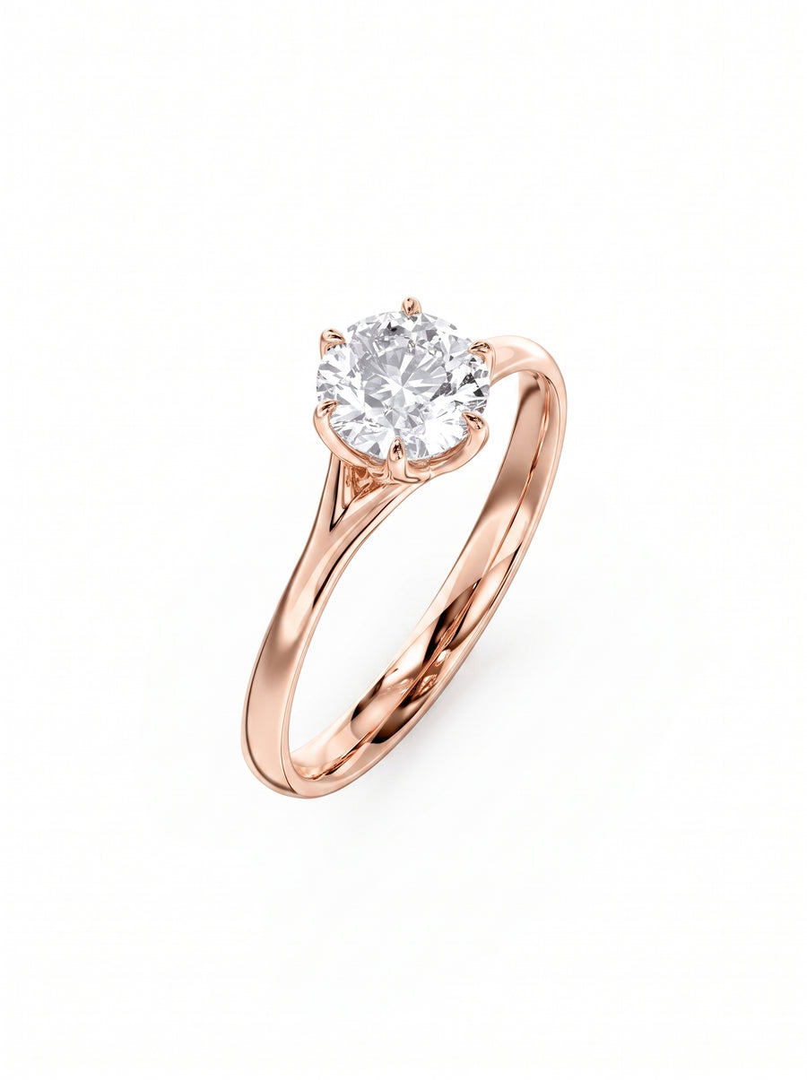 Round cut diamond engagement ring in rose gold with a six-prong tulip claw setting.