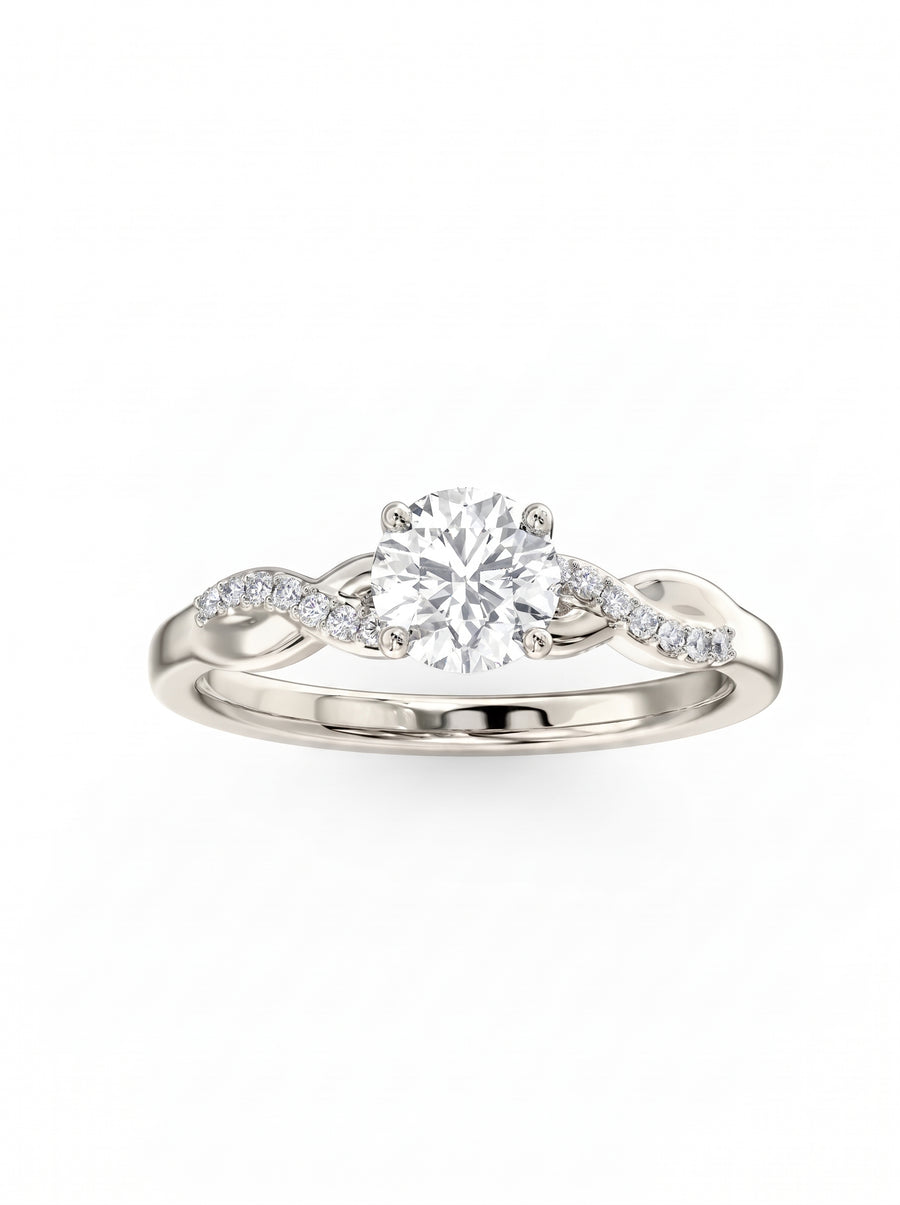 Round cut diamond engagement ring in silver metal with a twisted band and small pavé set stones.