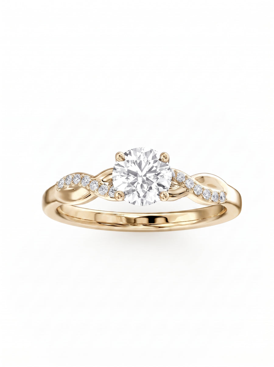 Round cut diamond engagement ring in yellow gold with a twist claw setting and pavé side stones.