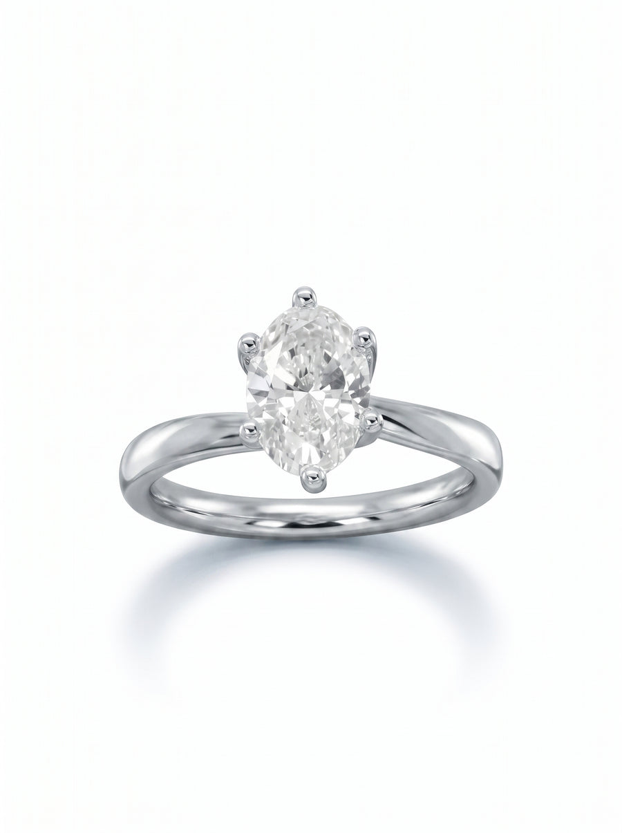 Oval diamond engagement ring with a twisted platinum band and a six-prong setting.