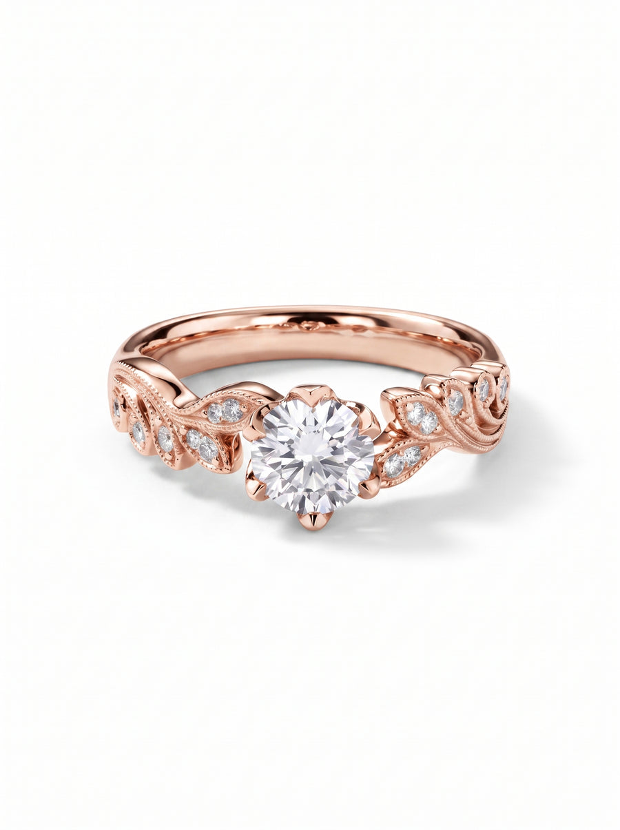 Rose gold engagement ring with a round diamond center stone and leaf-inspired beaded diamond accents.