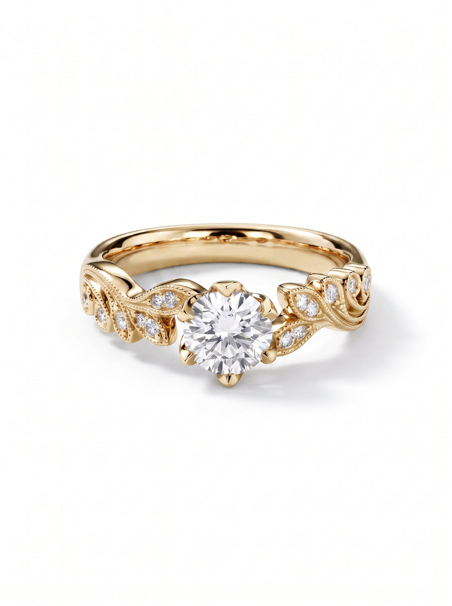 Gold engagement ring with a round diamond center stone and leaf-inspired diamond accents on the band.