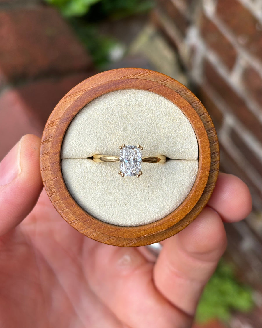 1.5ct cushion cut lab-grown diamond engagement ring with a hidden halo set in 18ct yellow gold.