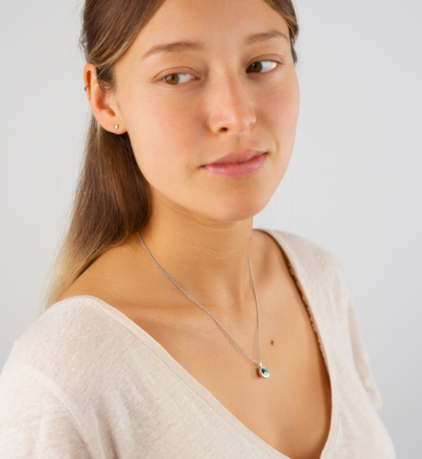 Model wearing simple pendant