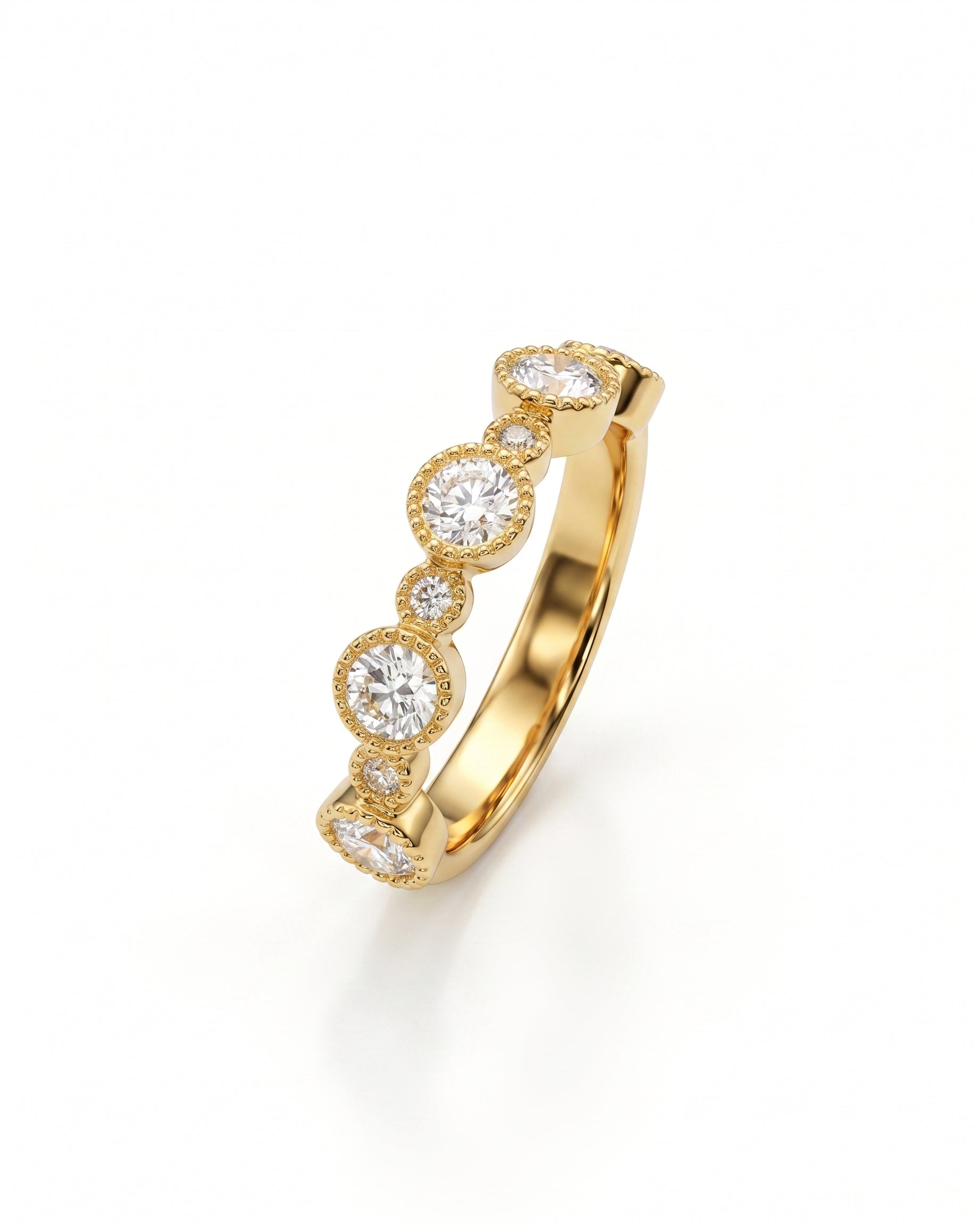 Gold eternity ring with alternating round diamonds in bezel settings.