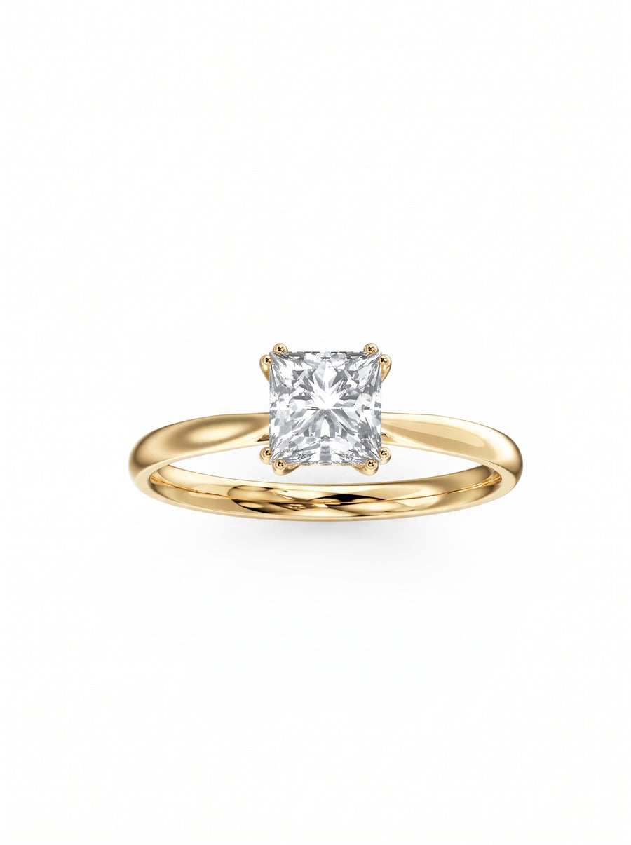 Princess cut diamond engagement ring with a hidden halo on a polished yellow gold band.