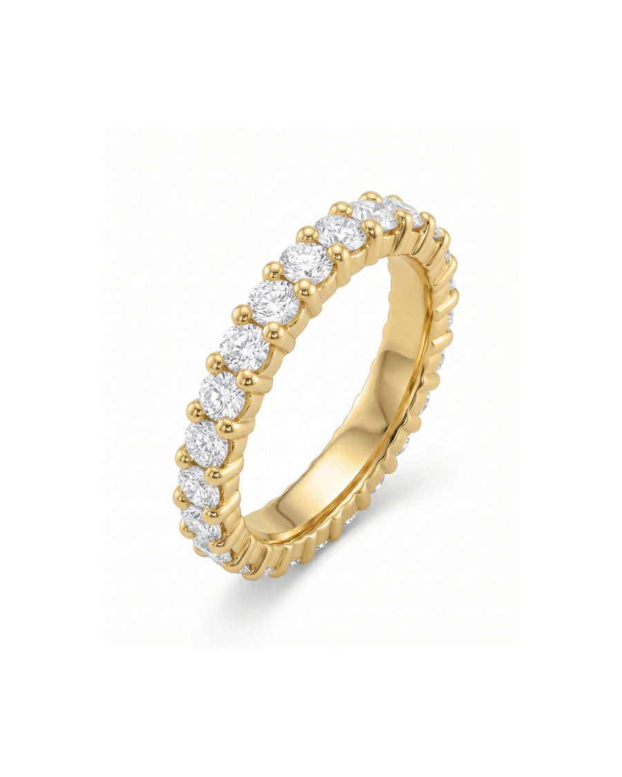 Gold full eternity ring with claw set round diamonds.