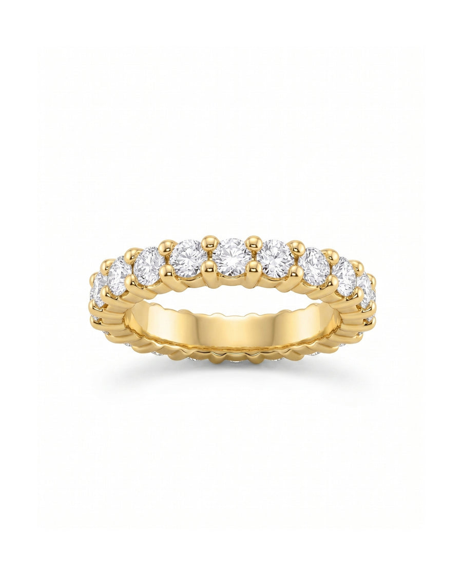Gold claw set full eternity ring with round diamonds.