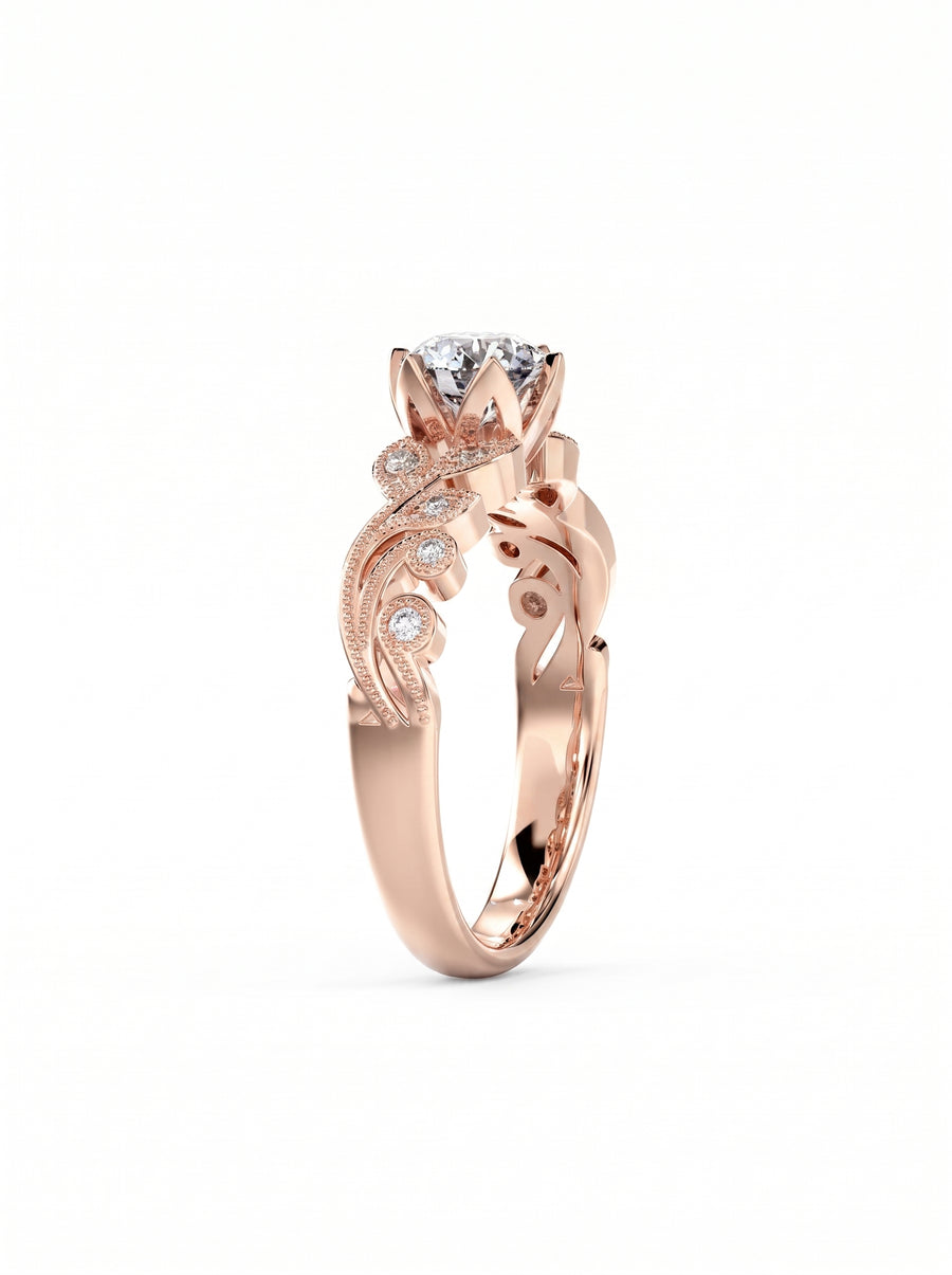 Rose gold vintage engagement ring with a round cut center diamond and intricate floral filigree side accents.