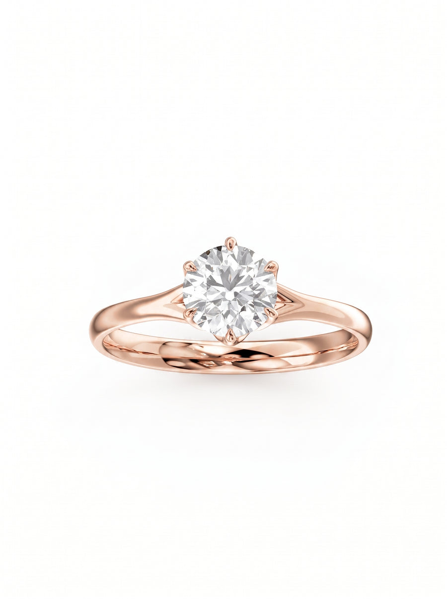 Round cut diamond engagement ring in rose gold with a six-prong tulip claw setting.