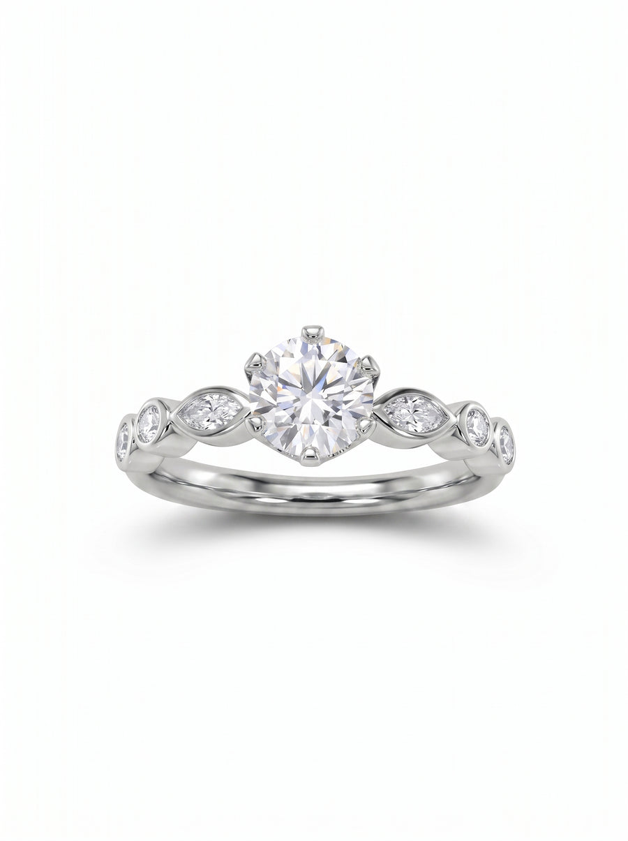 Round cut diamond engagement ring in platinum with marquise and round side stones on a polished band.