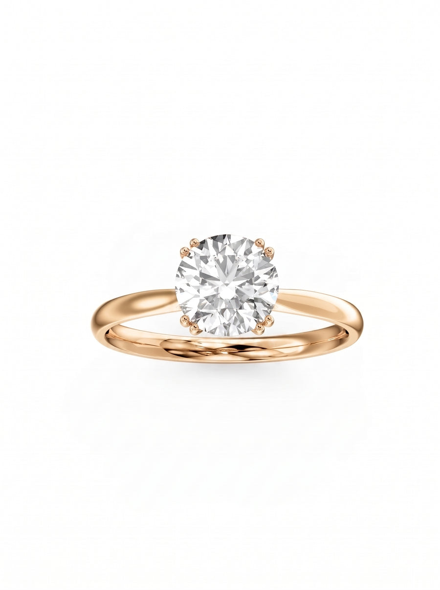 Round cut diamond engagement ring with a hidden halo set in polished 14k rose gold.