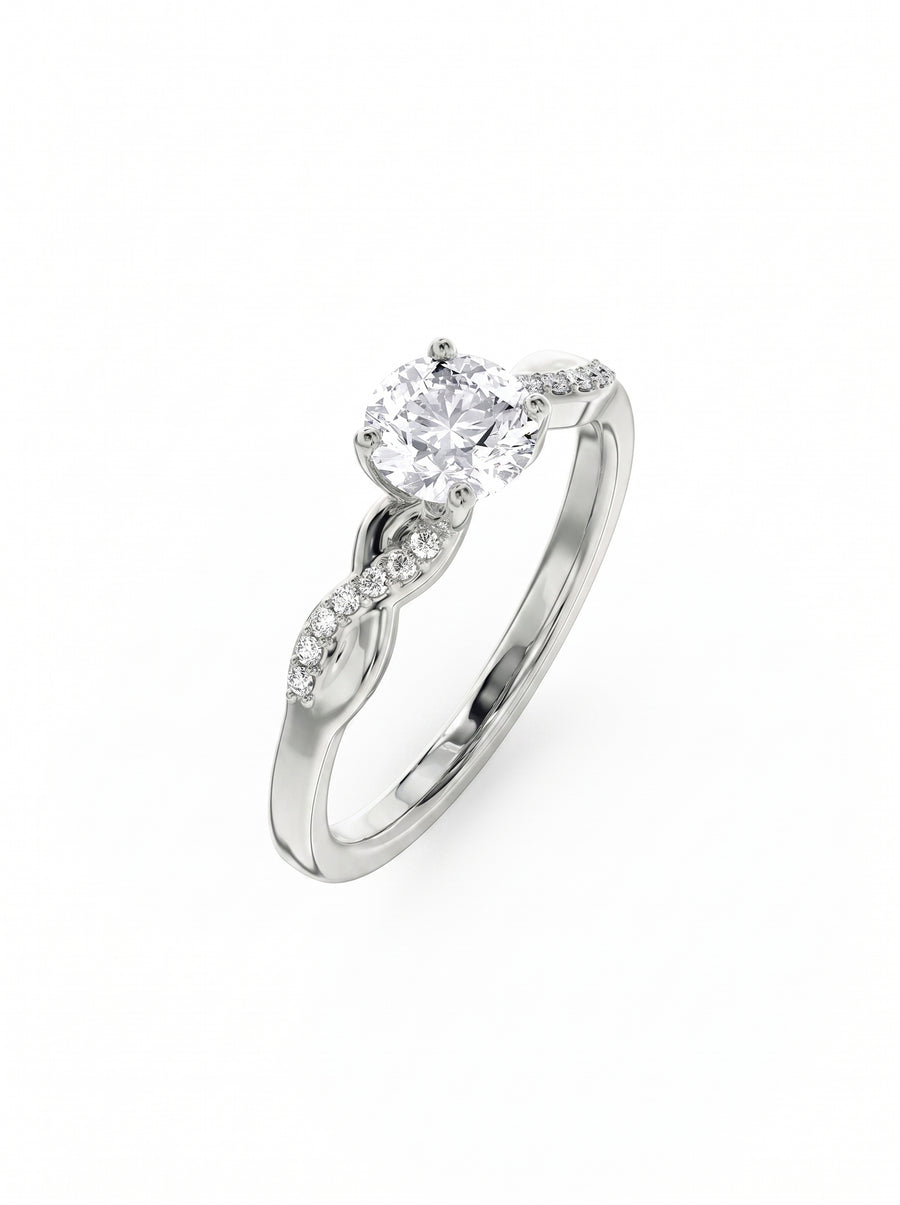Round cut diamond engagement ring in silver with a twisted band and pavé set side stones.