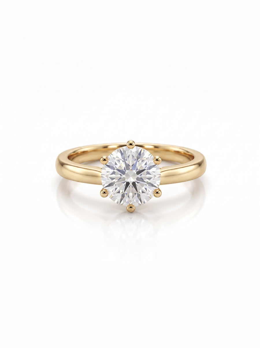 Round brilliant cut diamond engagement ring with a six-claw setting on a polished yellow gold band.