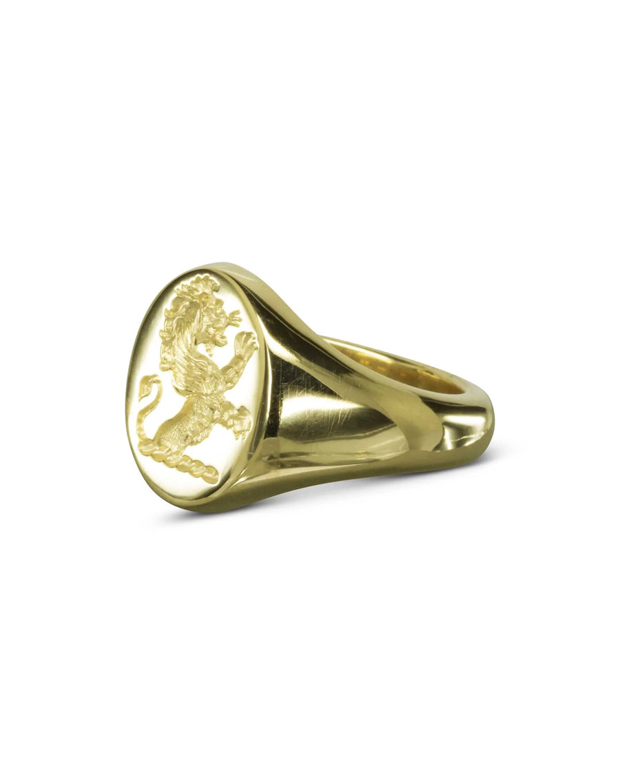 Gold signet ring with engraved rampant lion emblem, handcrafted fine jewellery