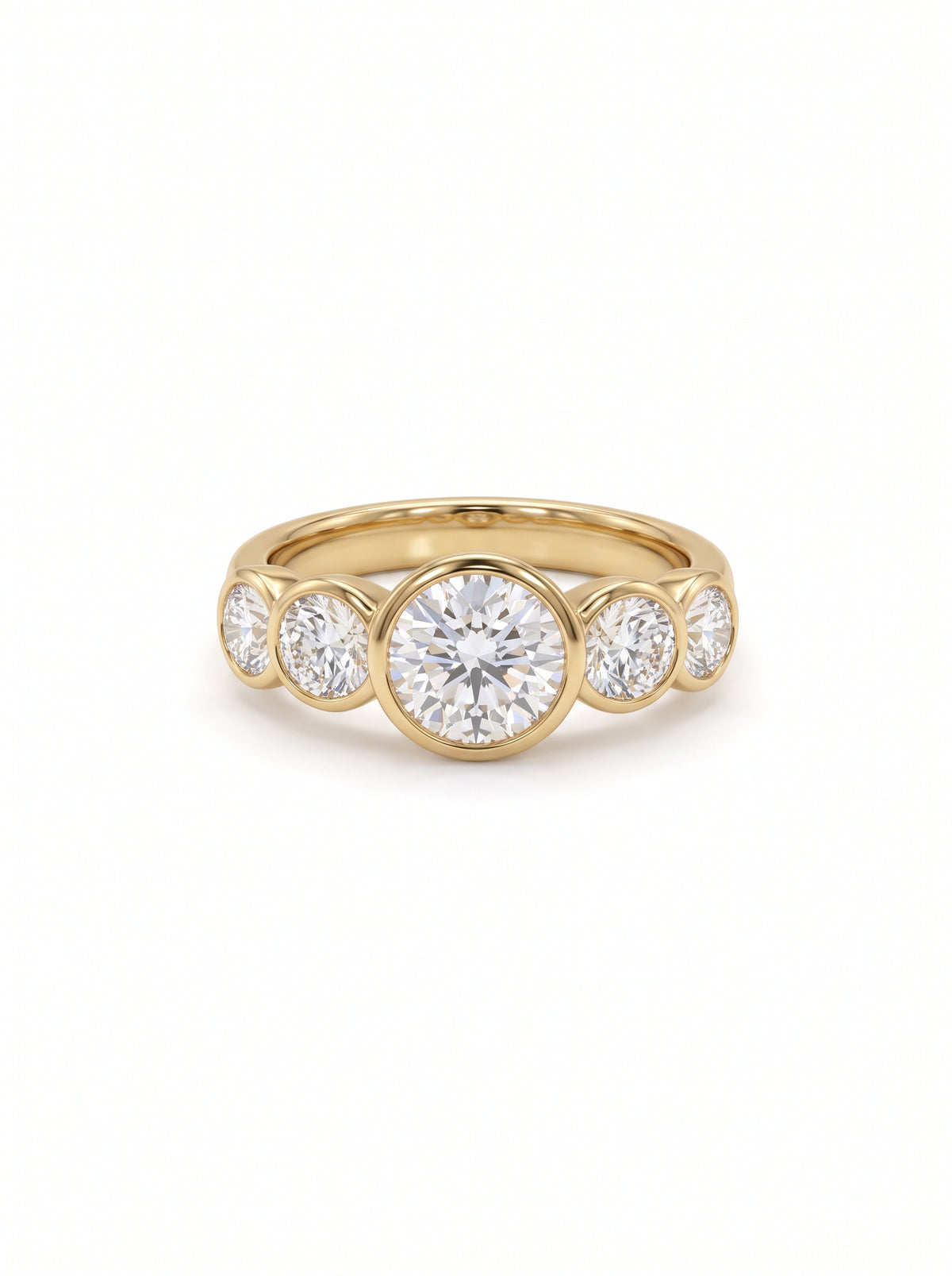 Yellow gold ring with five round brilliant cut diamonds in a bezel setting.