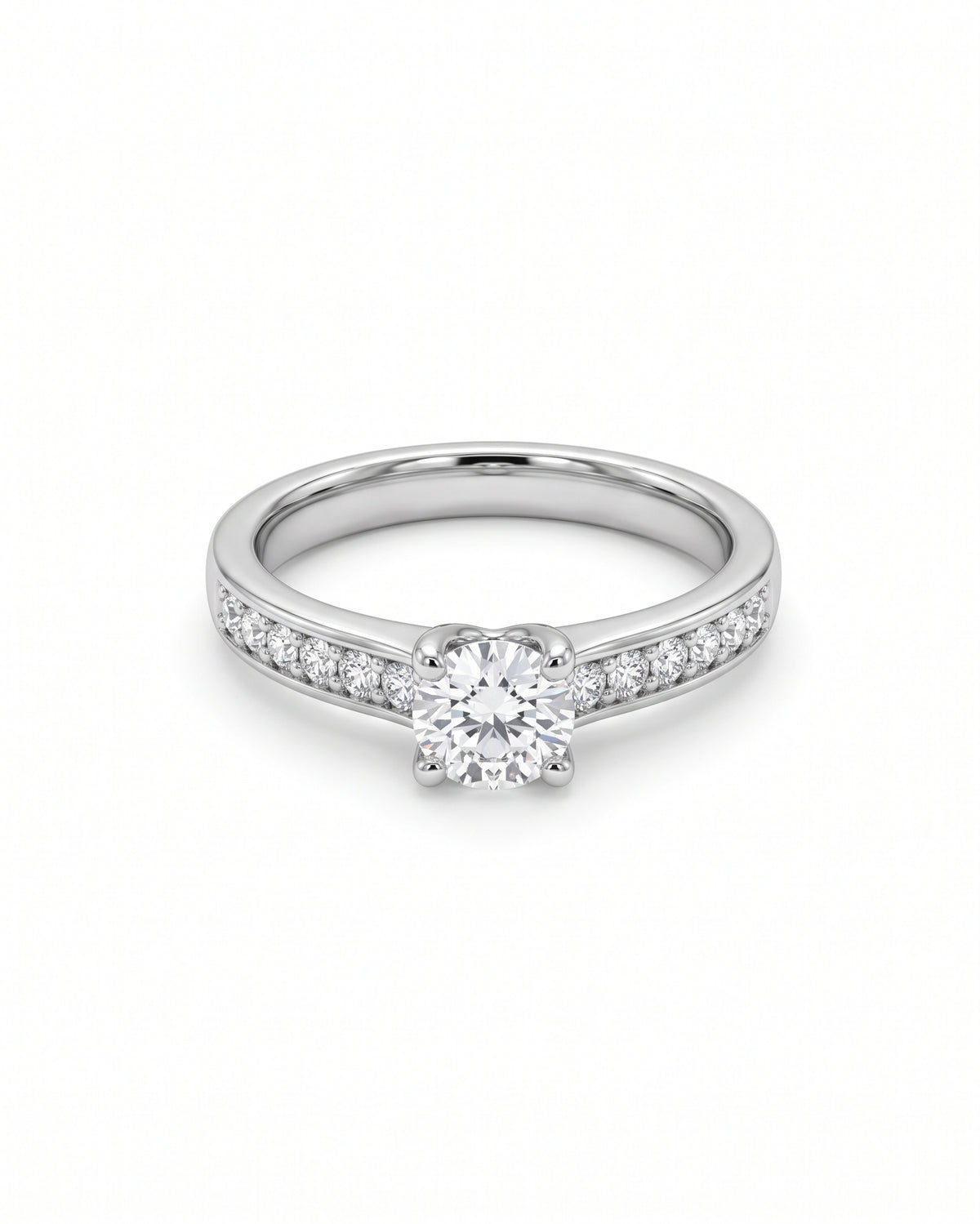 Platinum engagement ring with a round brilliant diamond center stone and pavé diamond shoulders.