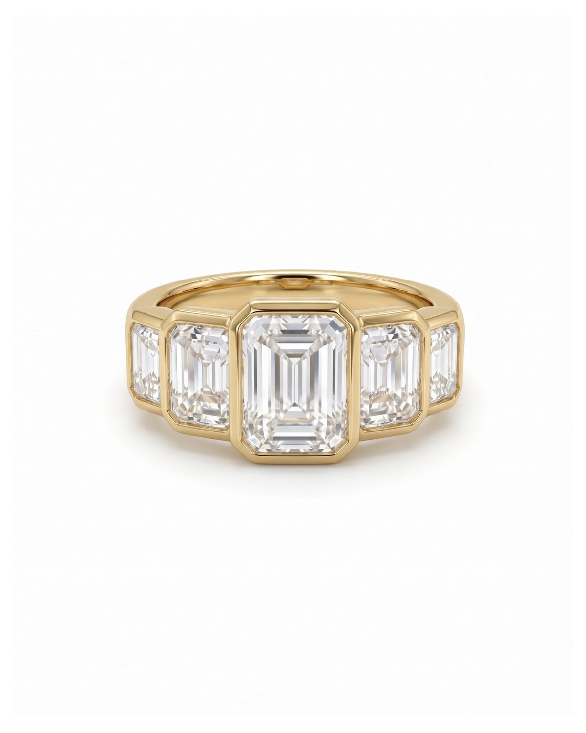 Gold ring featuring five bezel-set emerald cut diamonds in a horizontal art deco arrangement.