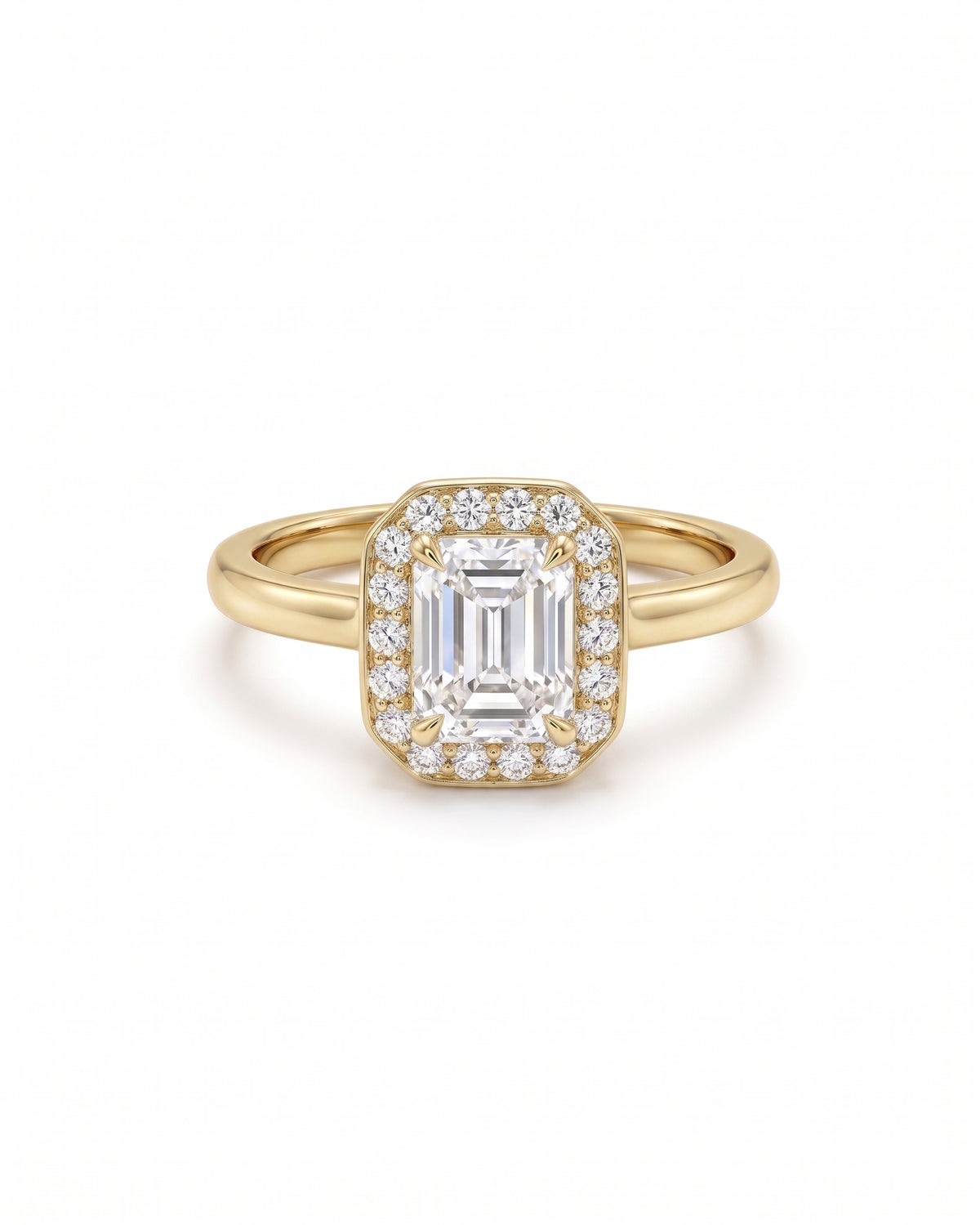 Emerald-cut diamond engagement ring with a diamond halo set in a yellow gold band.