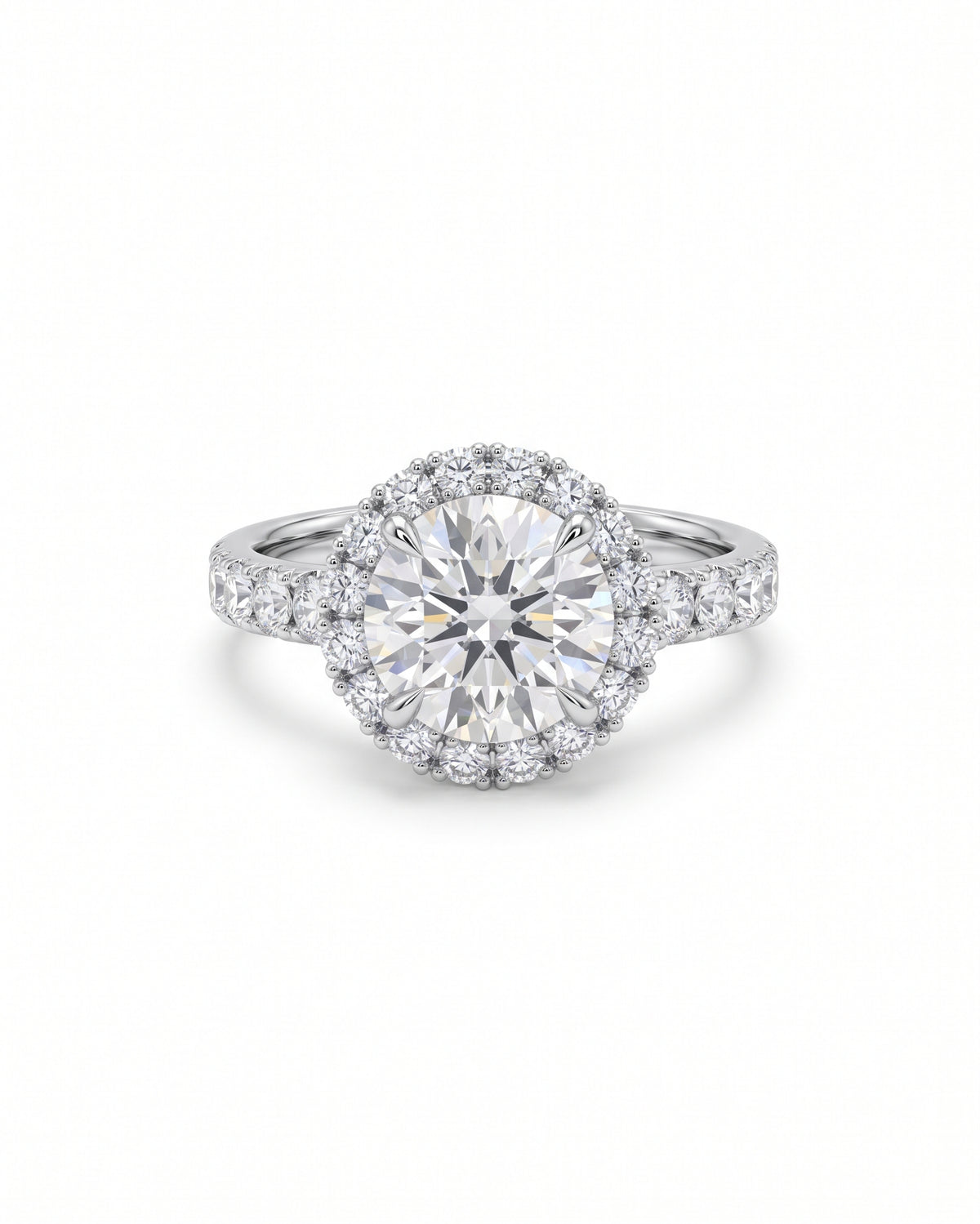 Round diamond cluster engagement ring in white gold with a halo setting and pavé band.
