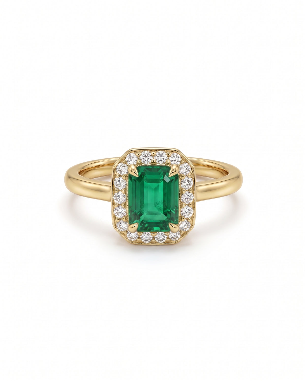 Emerald-cut emerald engagement ring with a diamond halo set in 18ct yellow gold.