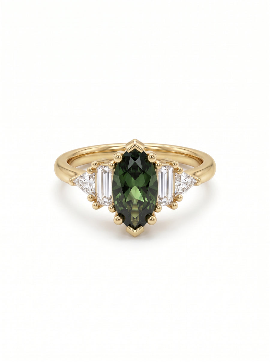 Marquise cut green sapphire engagement ring in yellow gold with baguette and trillion side diamonds.