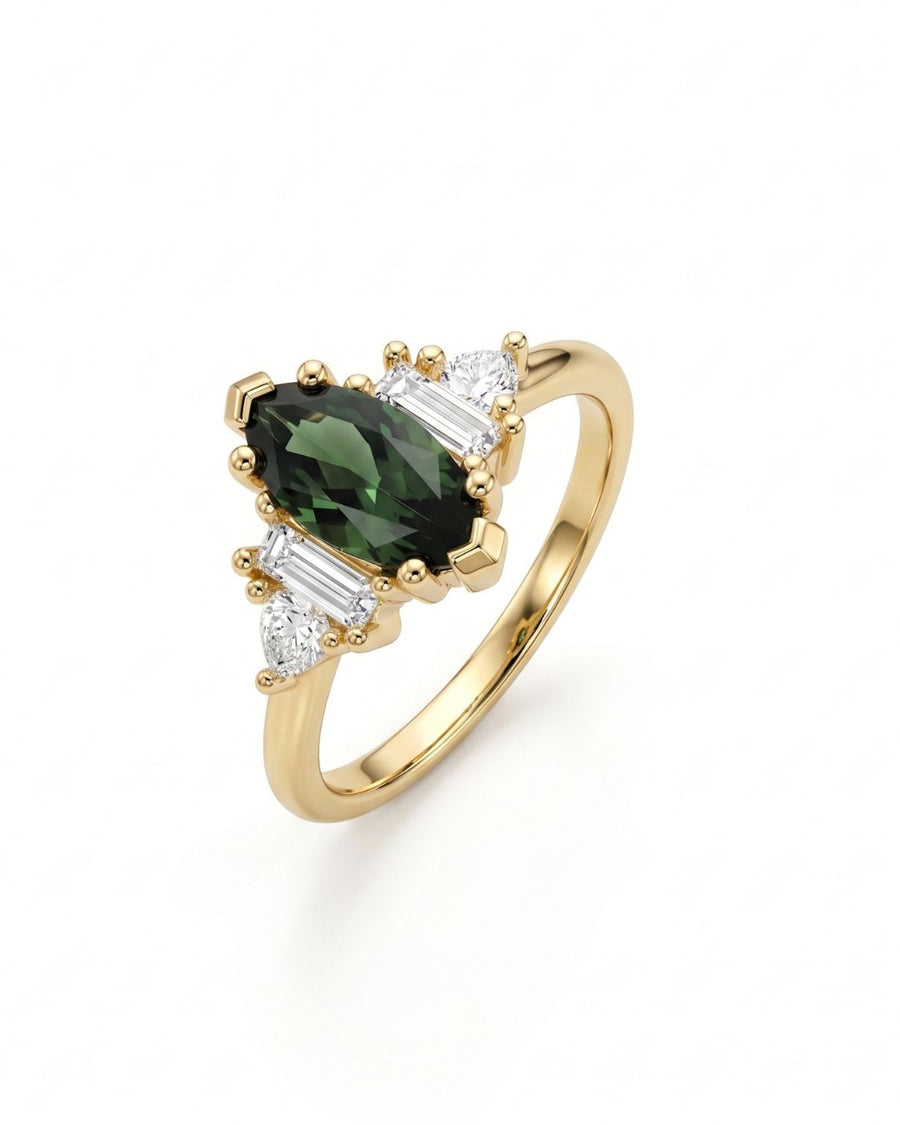 Marquise cut green sapphire engagement ring in yellow gold with baguette and pear side stones.