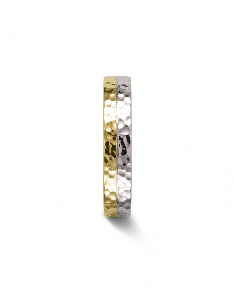Two-tone wedding ring featuring a hammered texture in yellow and white gold.