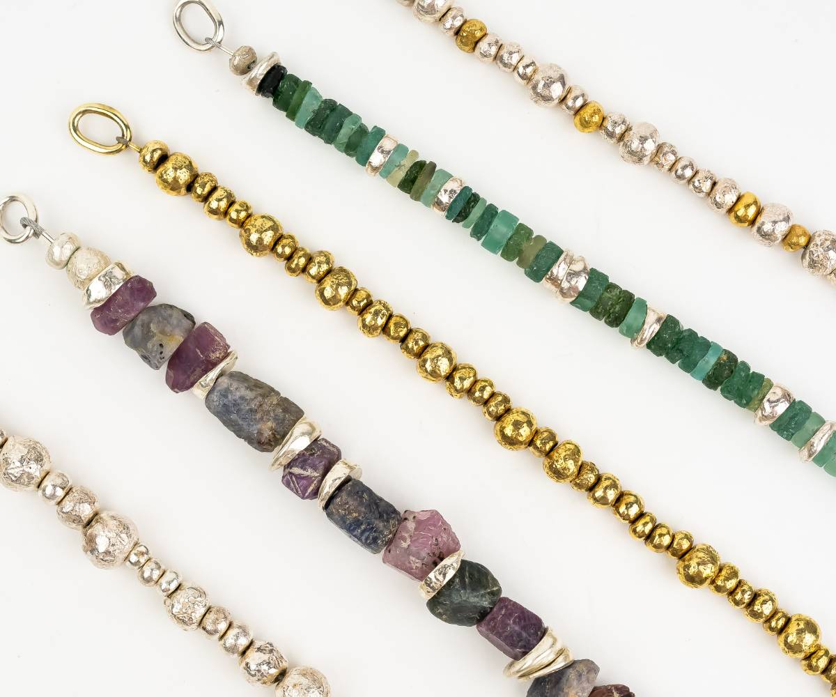 five hand strung bracelets