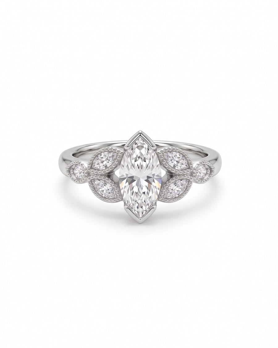 Marquise cut diamond engagement ring in silver metal with small marquise side stones and milgrain detailing.