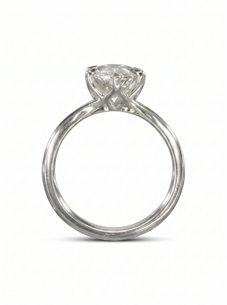 Marquise cut diamond engagement ring in platinum with a tulip-style claw setting on a polished band.