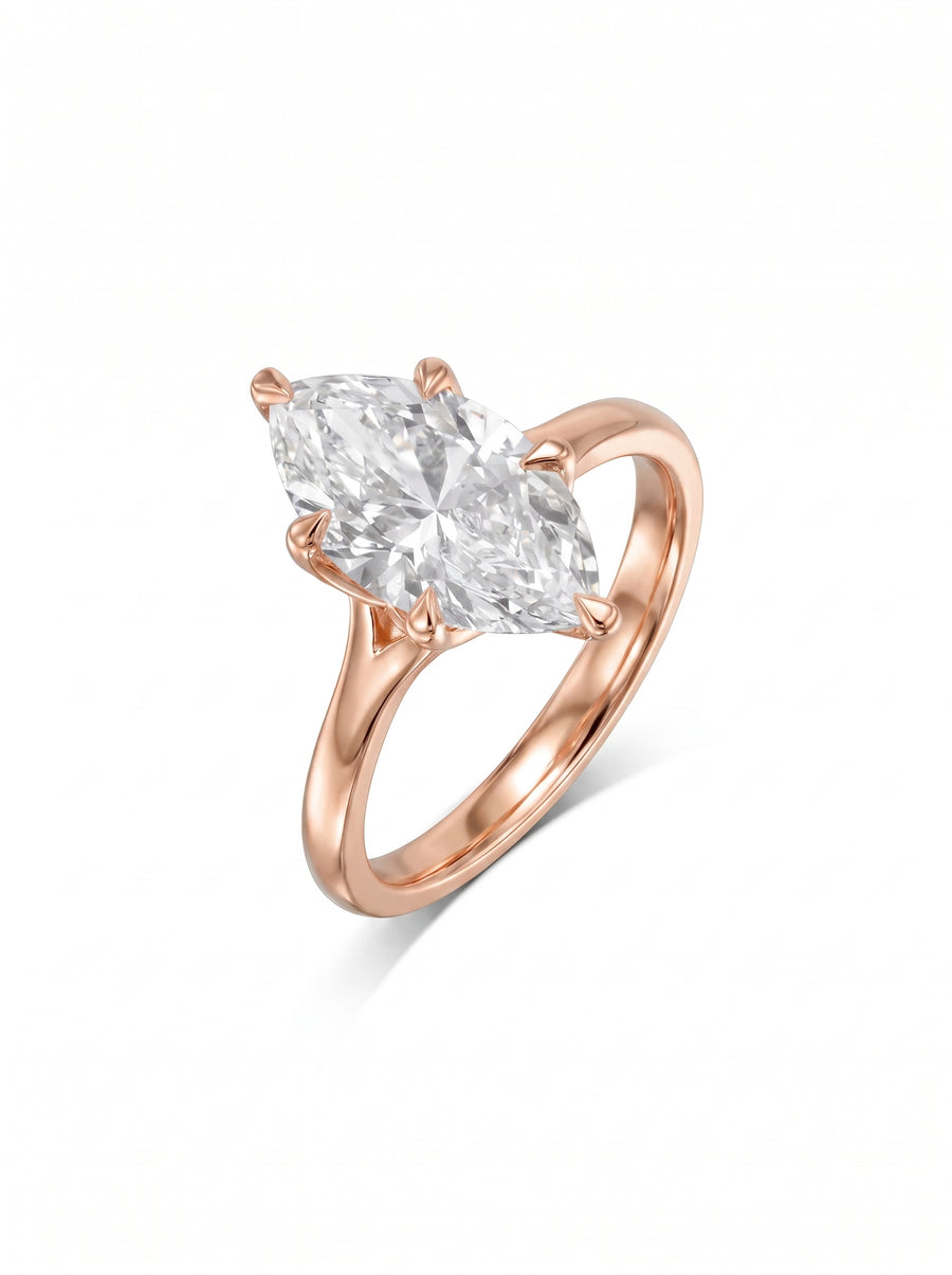 Marquise cut diamond engagement ring set in a rose gold tulip claw setting on a plain band.
