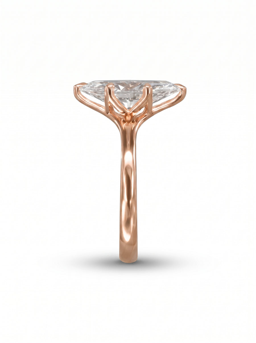 Marquise cut diamond engagement ring in rose gold with a tulip-style claw setting.