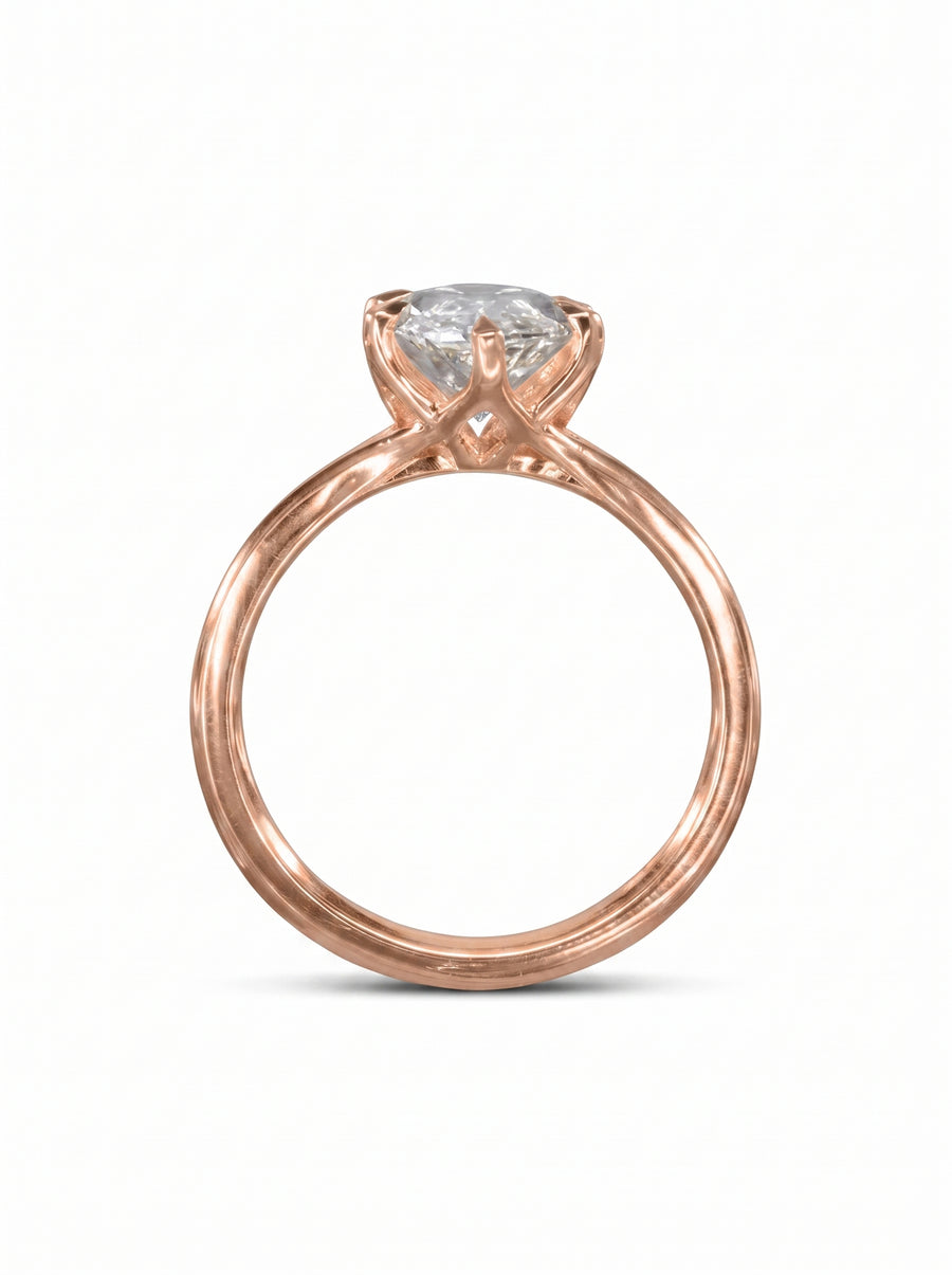 Marquise cut diamond engagement ring set in a rose gold tulip claw setting.