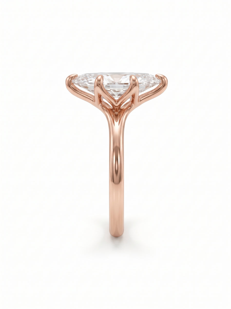 Marquise cut diamond engagement ring in rose gold with a tulip-style claw setting.