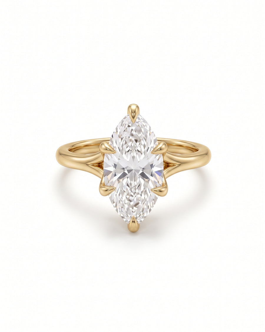 Marquise cut diamond engagement ring with a tulip claw setting in polished yellow gold.