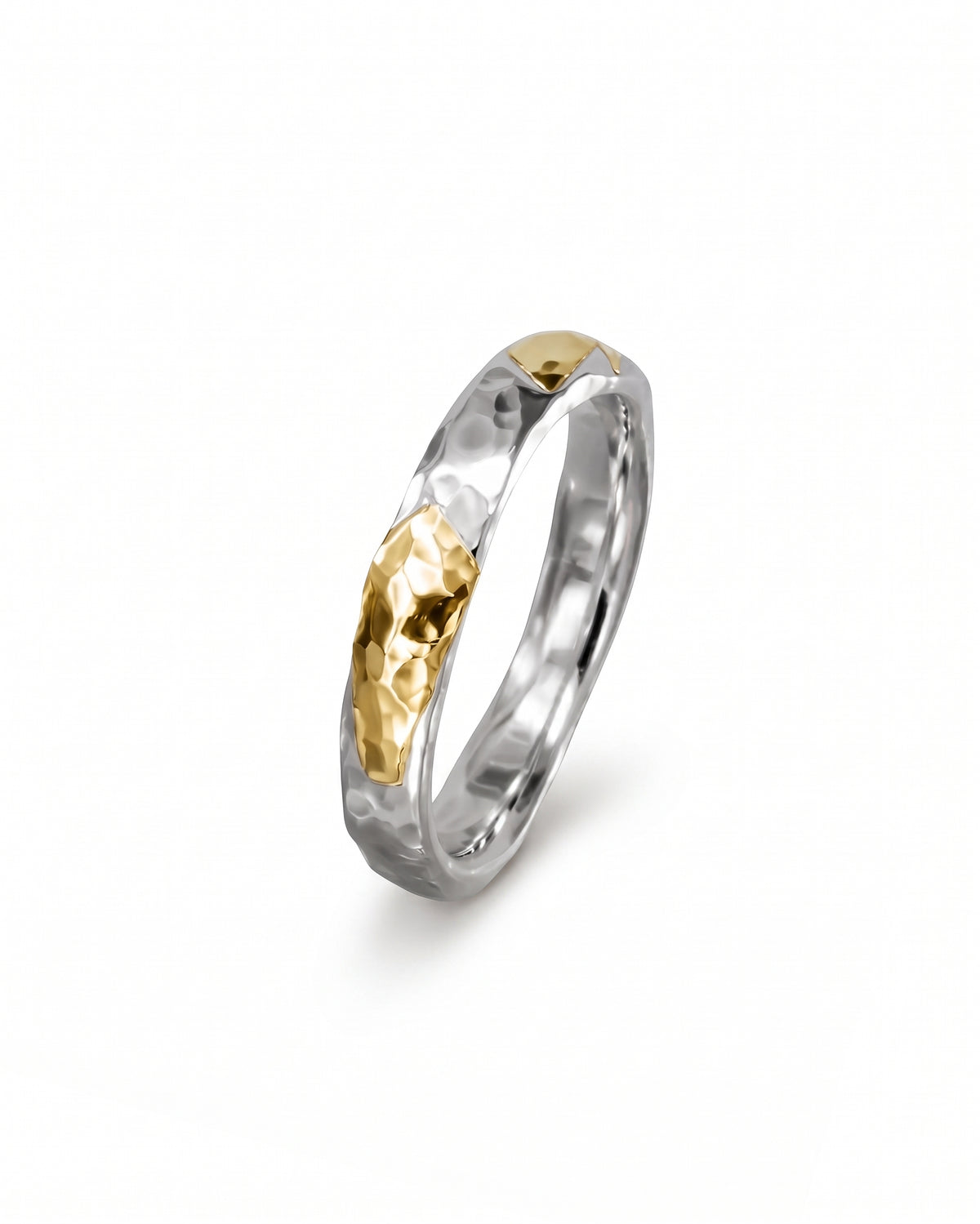 Hammered court ring in silver and gold with a textured mixed metal finish.