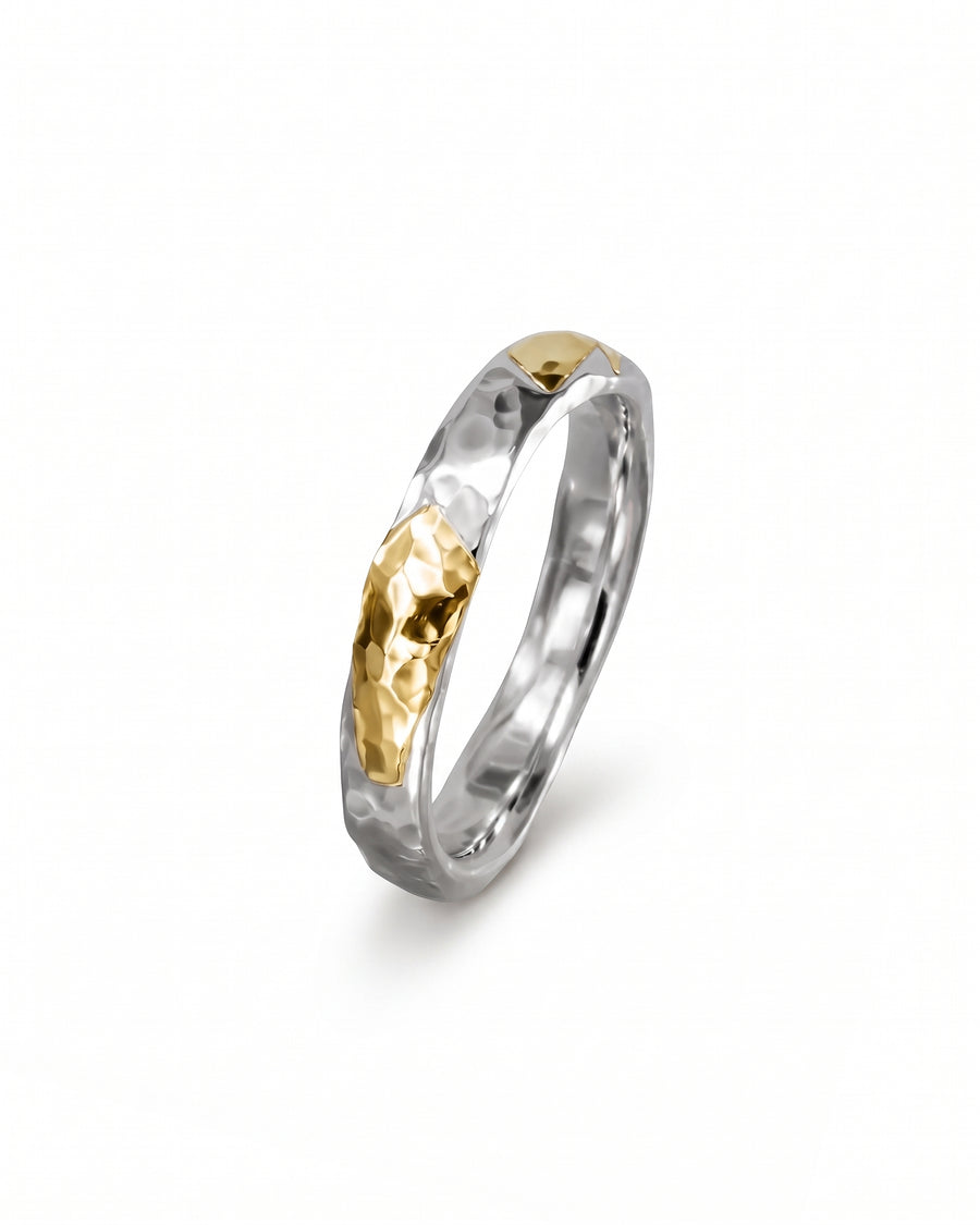 Hammered court ring in silver and gold with a textured mixed metal finish.